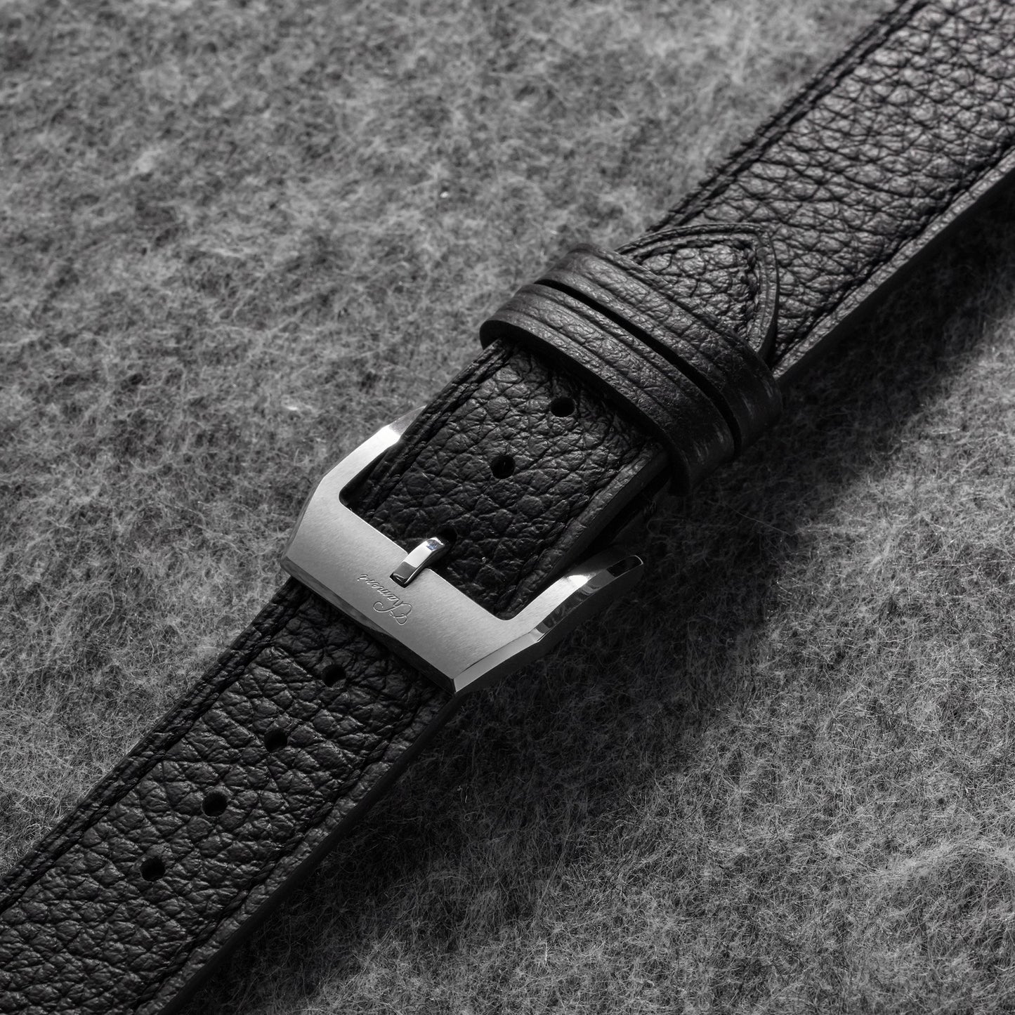 Back view of 20mm black pebbled leather watch strap with tan lining