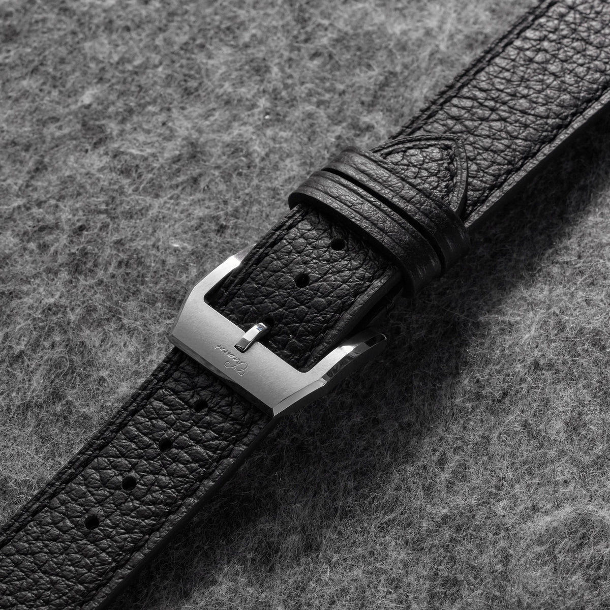 Back view of 20mm black pebbled leather watch strap with tan lining