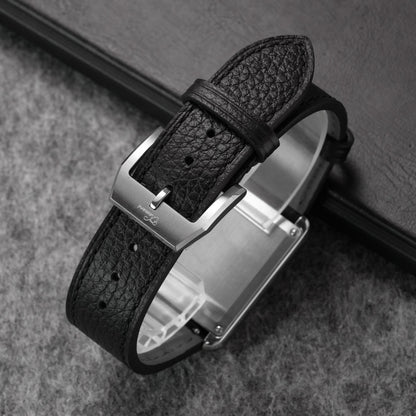 Close-up of black pebbled leather watch strap fitted to a dress watch