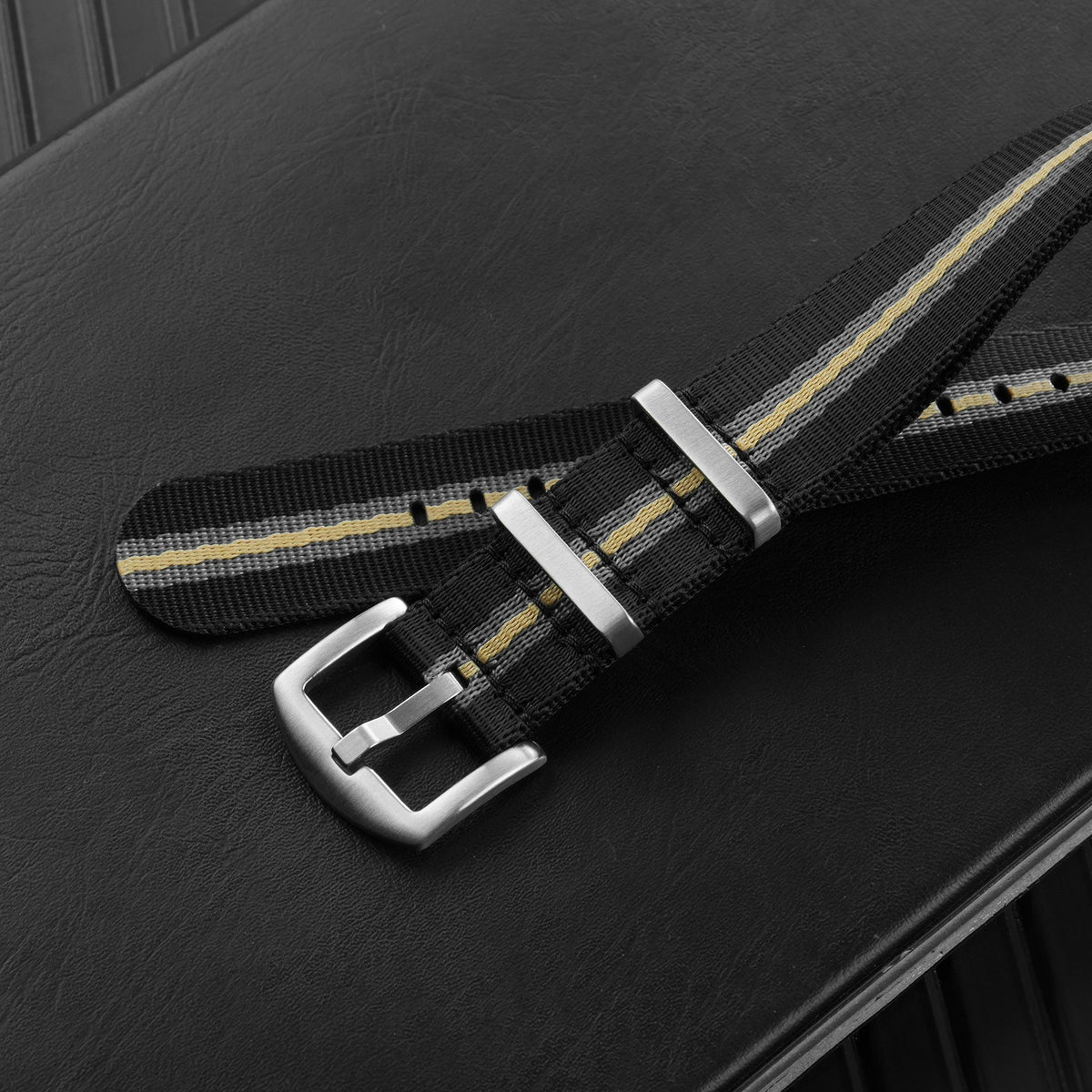 Striped nylon NATO watch strap with brushed silver-tone buckle and keepers
